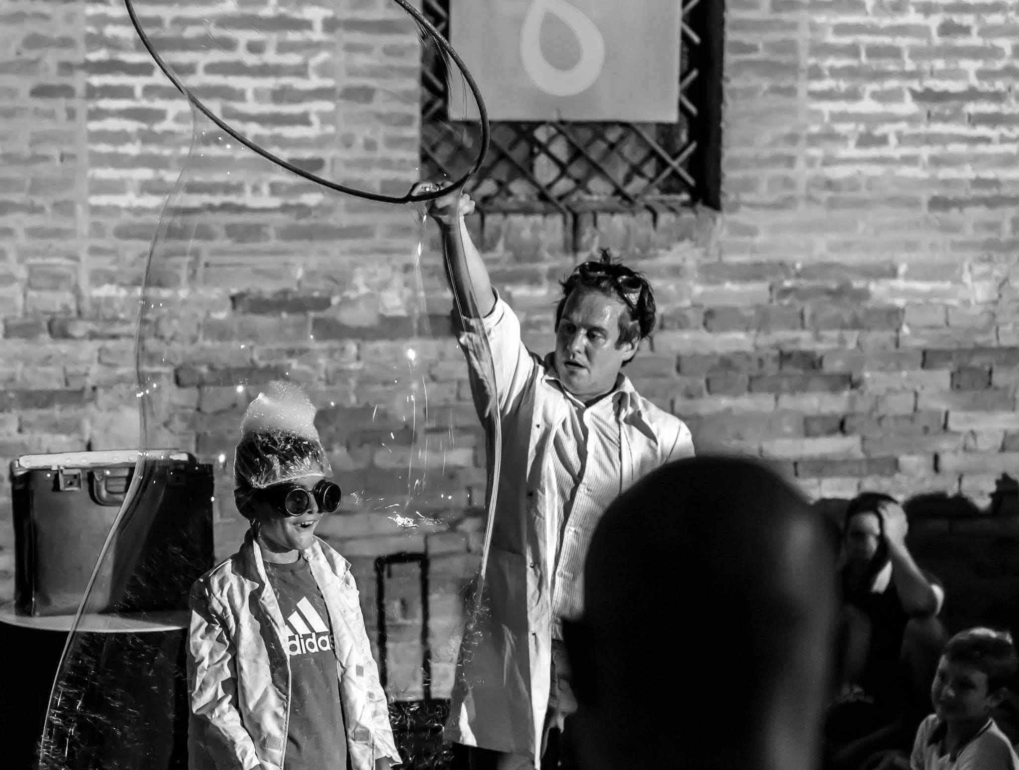 Prof. Bubbles performing a family bubble show at a festival